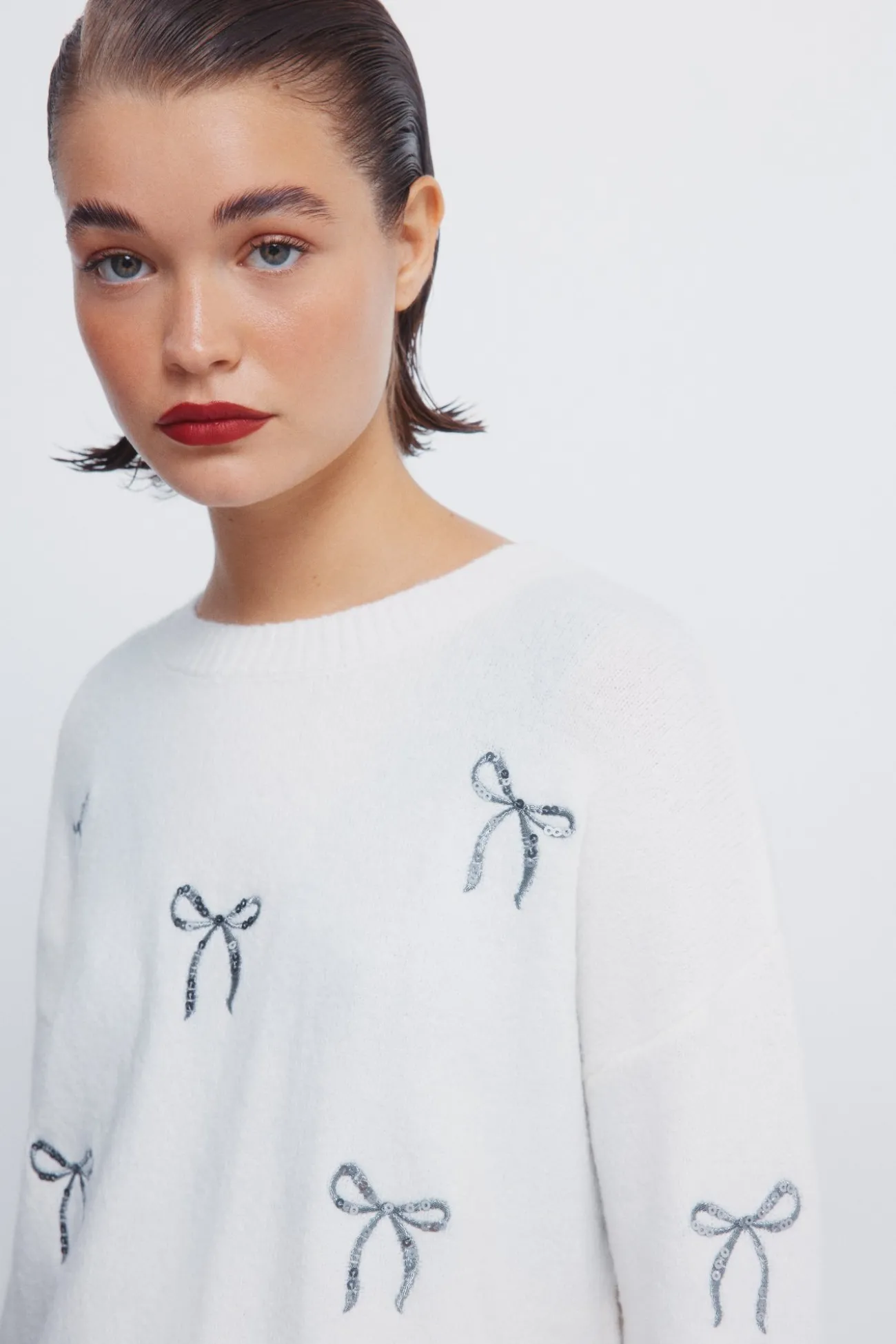 Pull avec nœuds à paillettes
