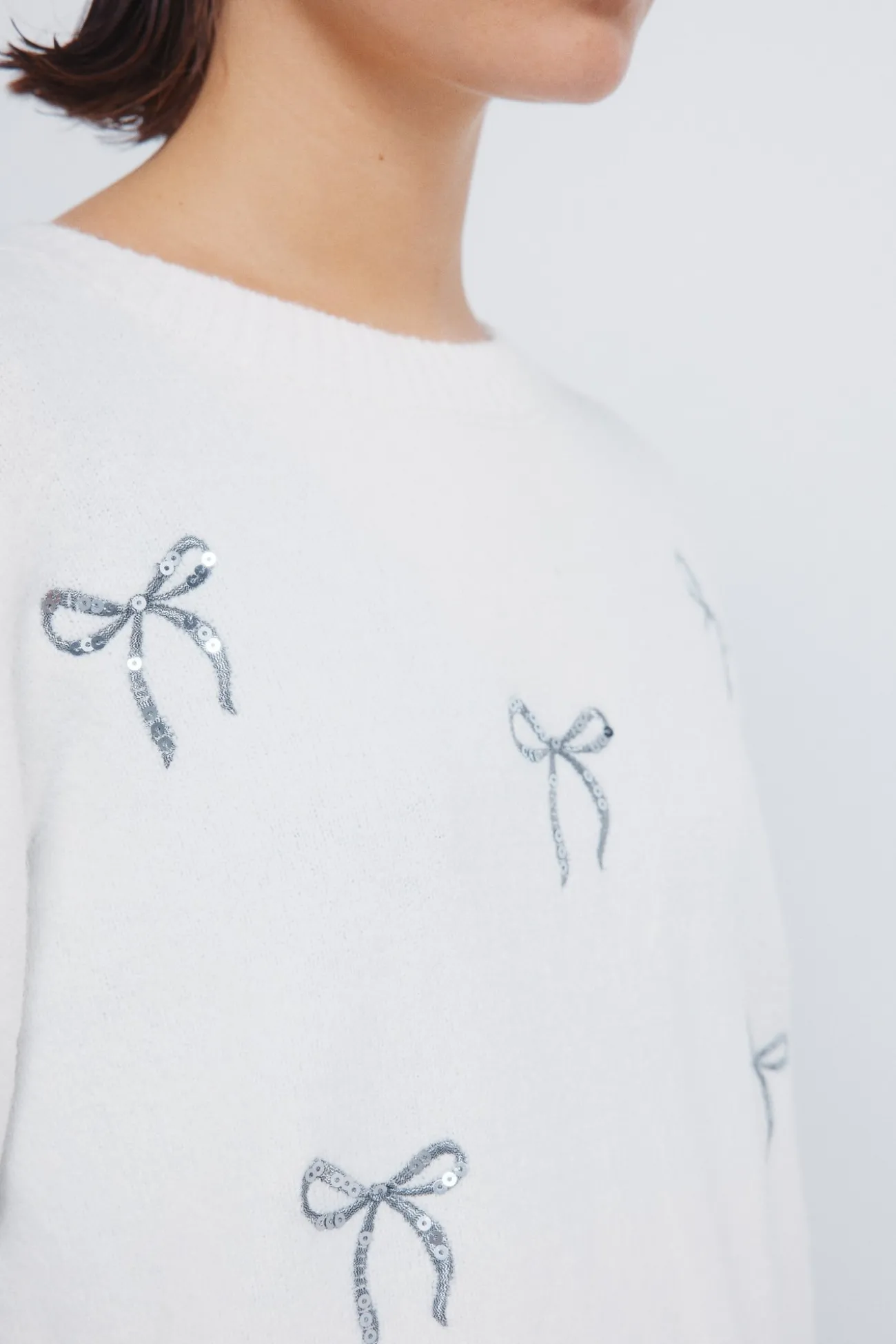 Pull avec nœuds à paillettes